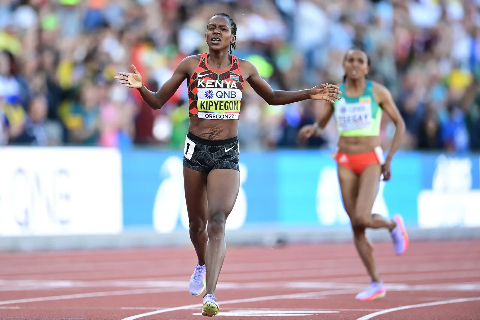 Faith Kipyegon of Kenya celebrating as she crosses the finish line at the 2022 World Championships in Oregon